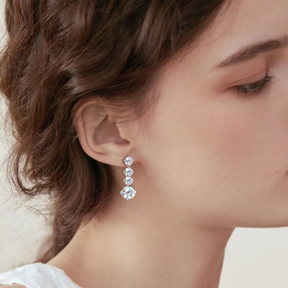 Silver cascade cubic zirconia drop earrings with four stones.