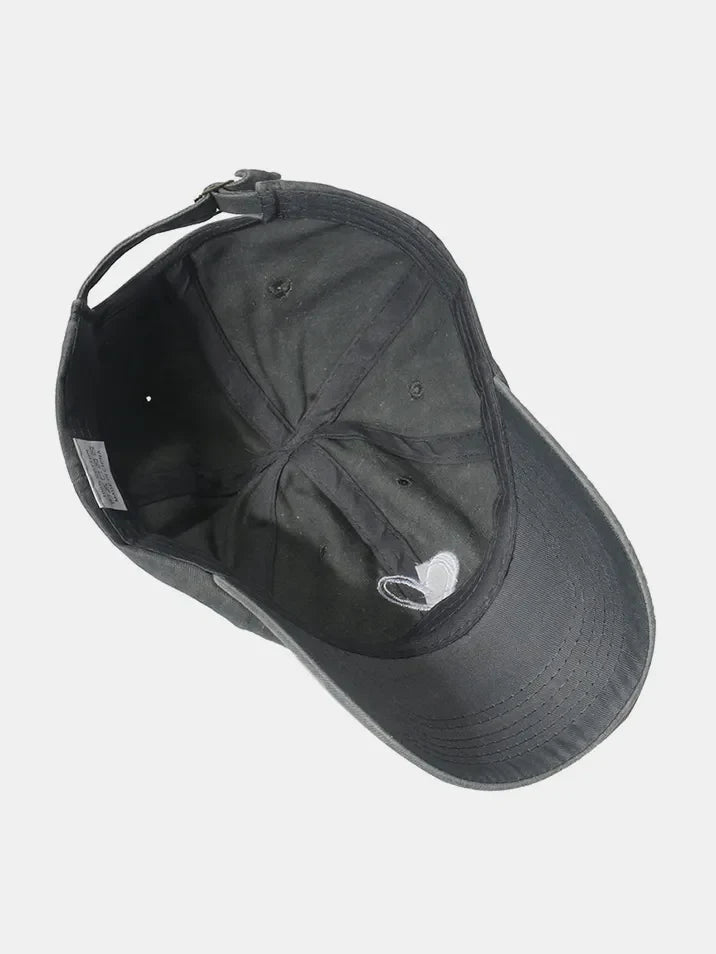 Black washed cotton baseball cap with embroidered heart detail and adjustable strap