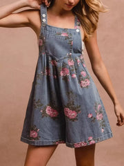 Denim floral overalls with pocket details and button straps.