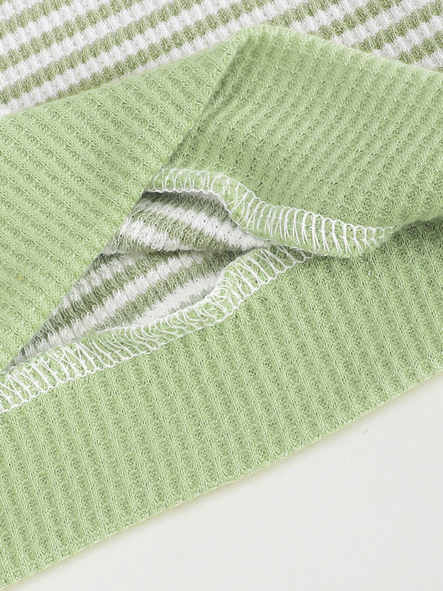 Green and white striped cotton polo shirt with waffle knit texture and white stitching detail.