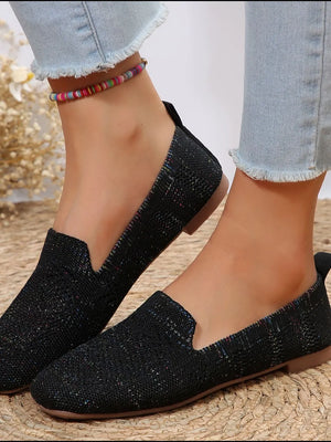 Black knit ballet flats with subtle multi-color flecks, slip-on style.