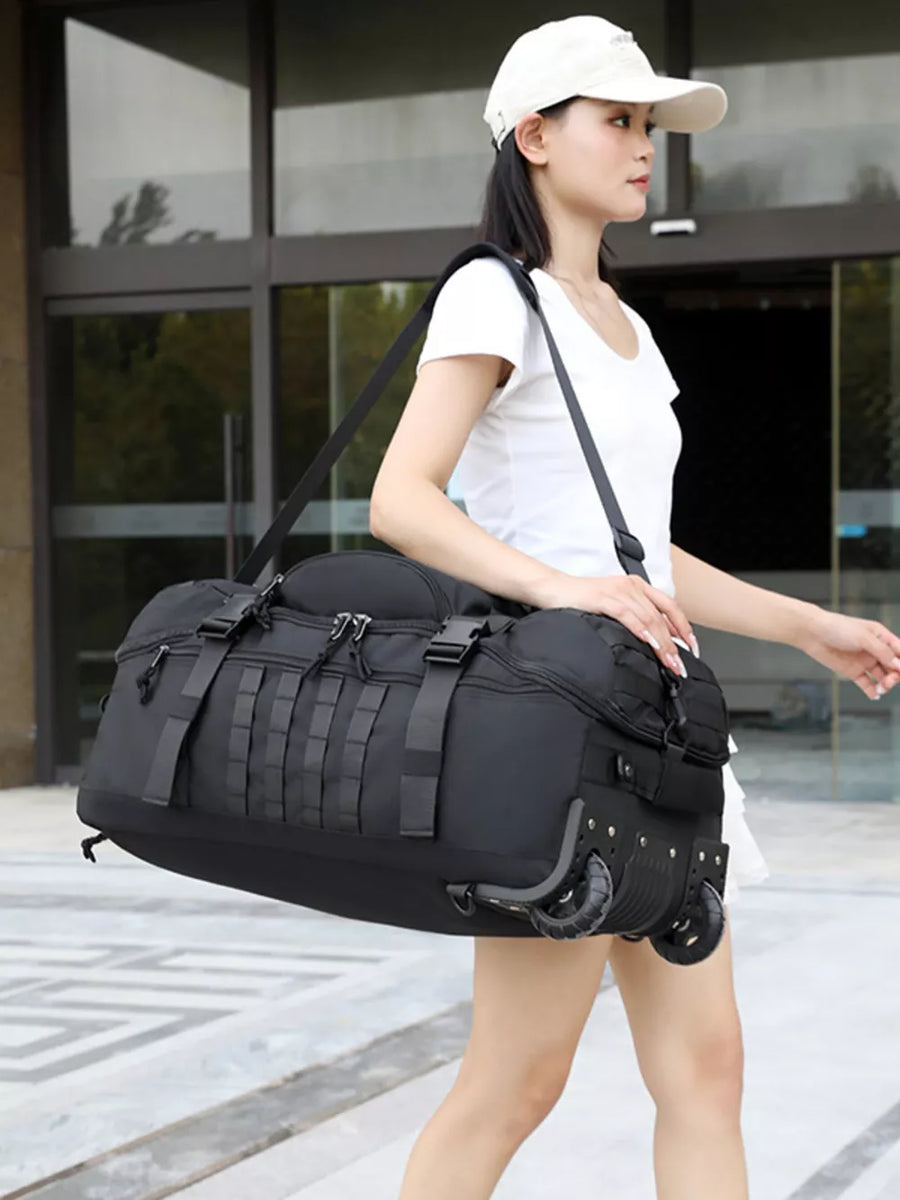 Black tactical rolling duffel bag with MOLLE webbing and adjustable straps