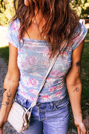 Square neck cap sleeve floral mesh top with ruched detail.