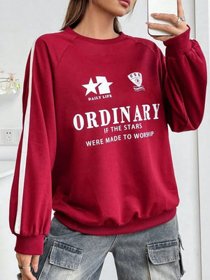 Deep red graphic sweatshirt with white stripe raglan sleeves and "ORDINARY" text.