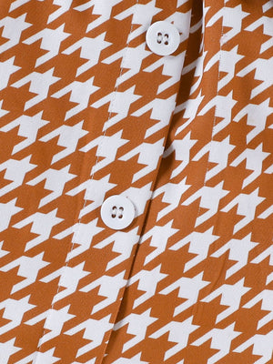 Toddler orange and white houndstooth button-down vest detail
