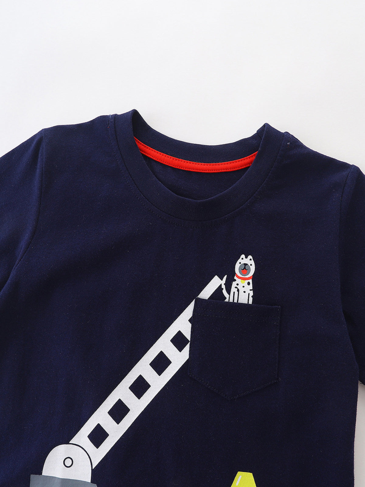 Navy cotton t-shirt with a playful dog graphic peeking from a chest pocket and a vehicle ladder design.