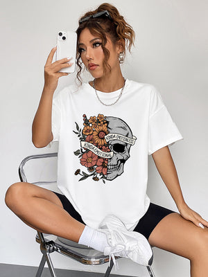 White oversized tee with a skull and floral graphic that says Kinda Emotional and Kinda Emotionless