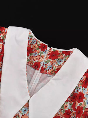 Floral print dress with white Peter Pan collar and zipper closure