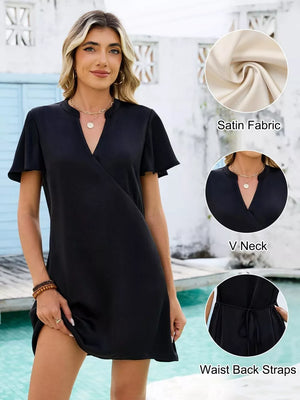 Black satin mini dress with V neck, flutter sleeves, and waist tie detail.