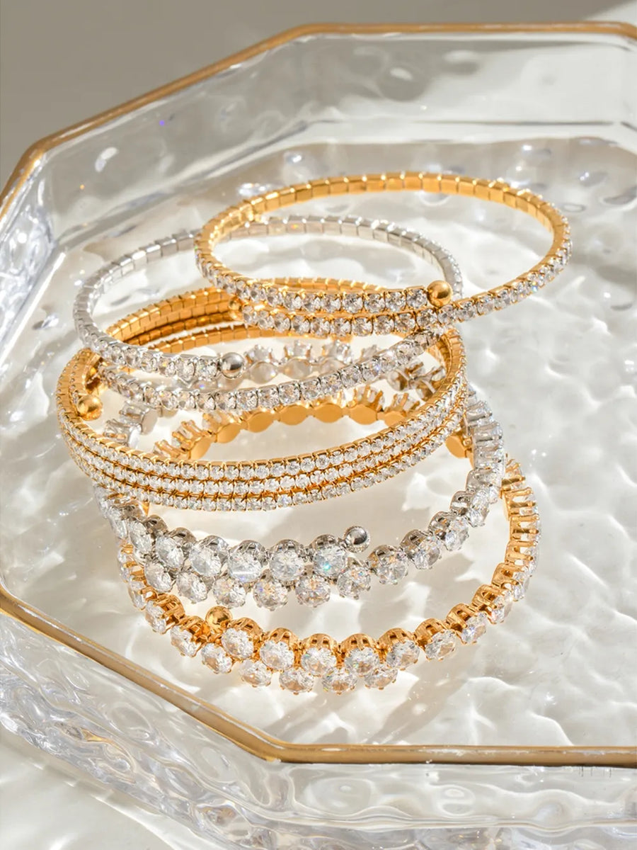 Gold and silver double row pavé bangles with clear crystals
