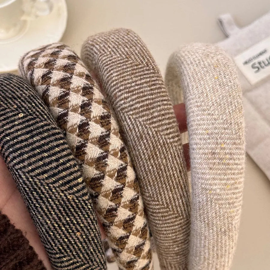 Textured tweed padded headbands in black, geometric, khaki, and coffee brown patterns.