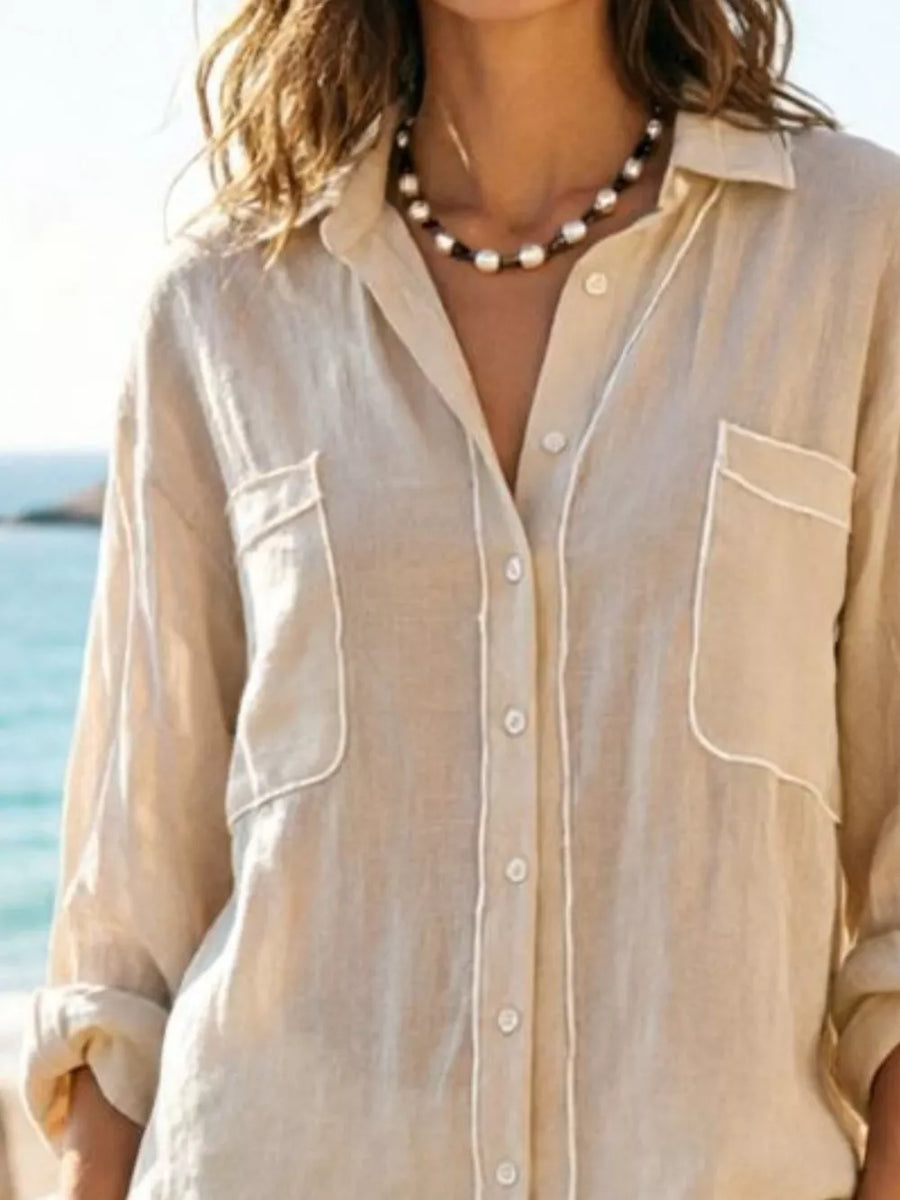 Beige linen button-down shirt with white piping and chest pockets
