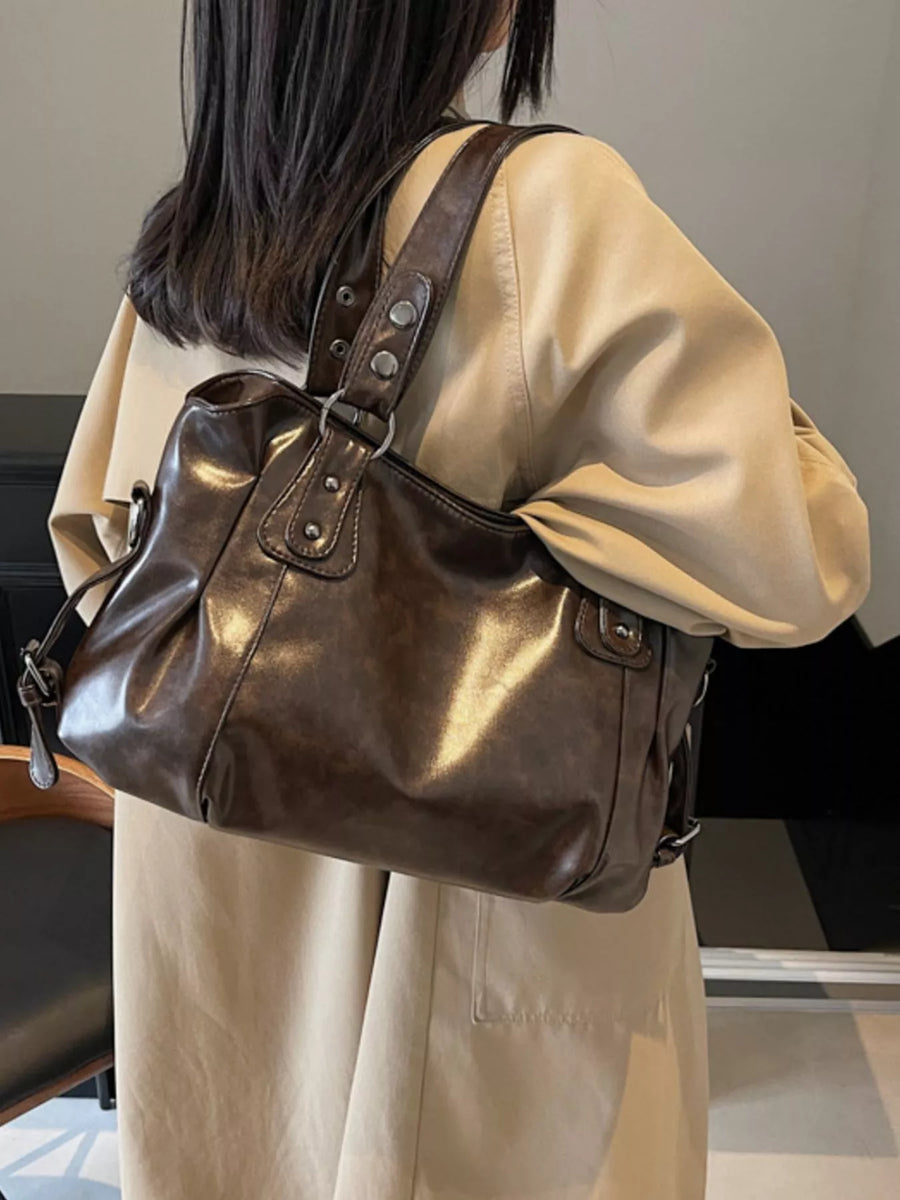 Large brown vintage PU leather shoulder bag with silver hardware details.