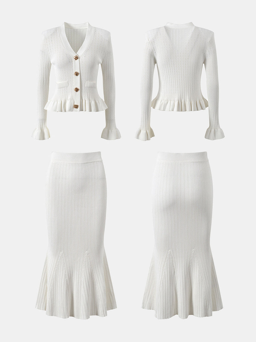 White knit cardigan with ruffled hem and bell sleeves, paired with a matching mermaid skirt.
