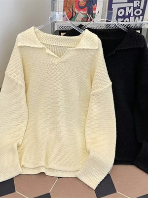 Textured knit polo collar sweater in apricot with a relaxed fit and V-neck.