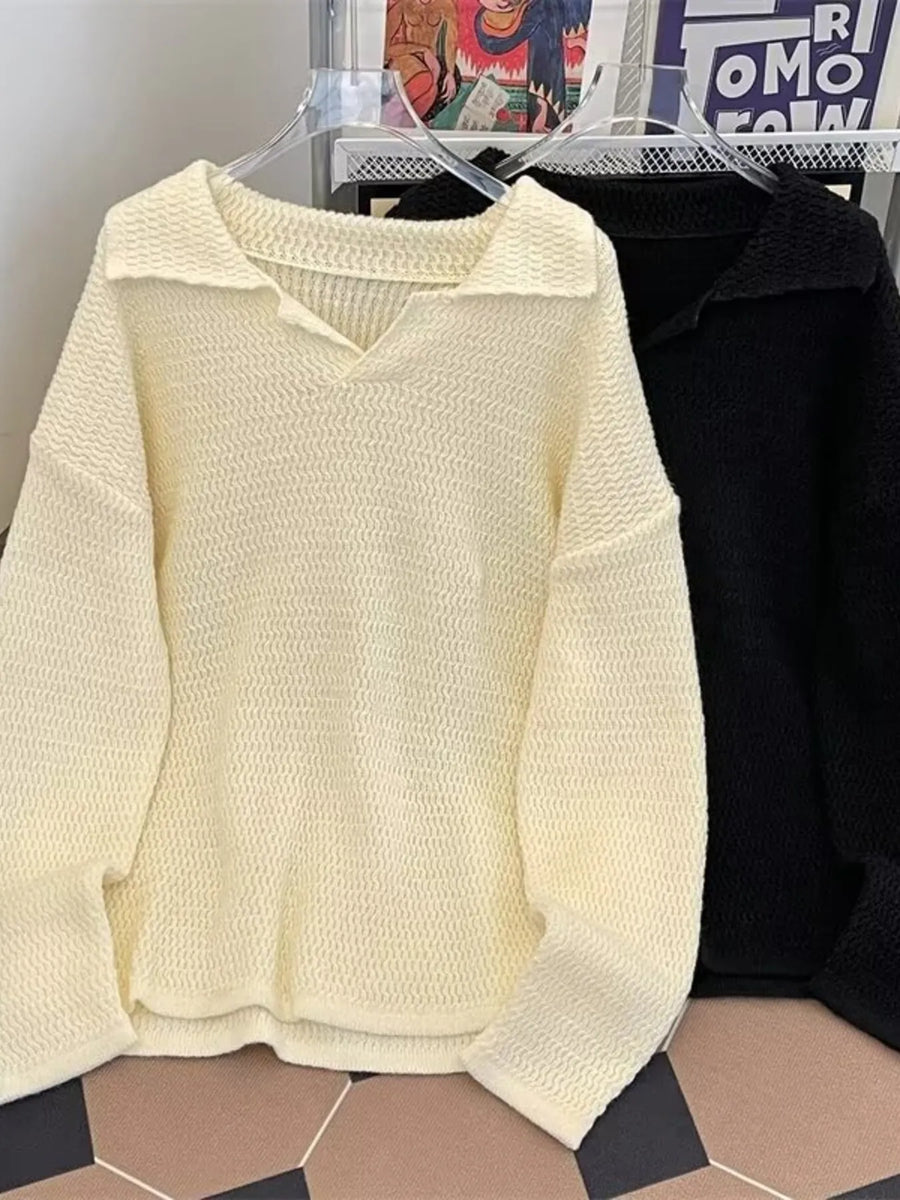 Textured knit polo collar sweater in apricot with a relaxed fit and V-neck.