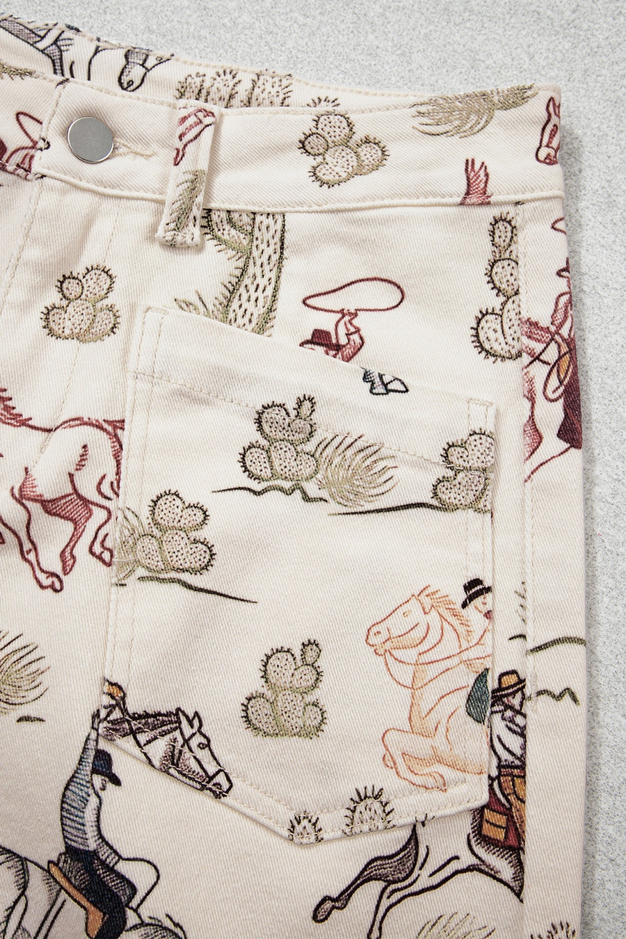 jeans featuring western print in rust with 98% cotton, 2% elastane Care instructions: Machine wash cold texture