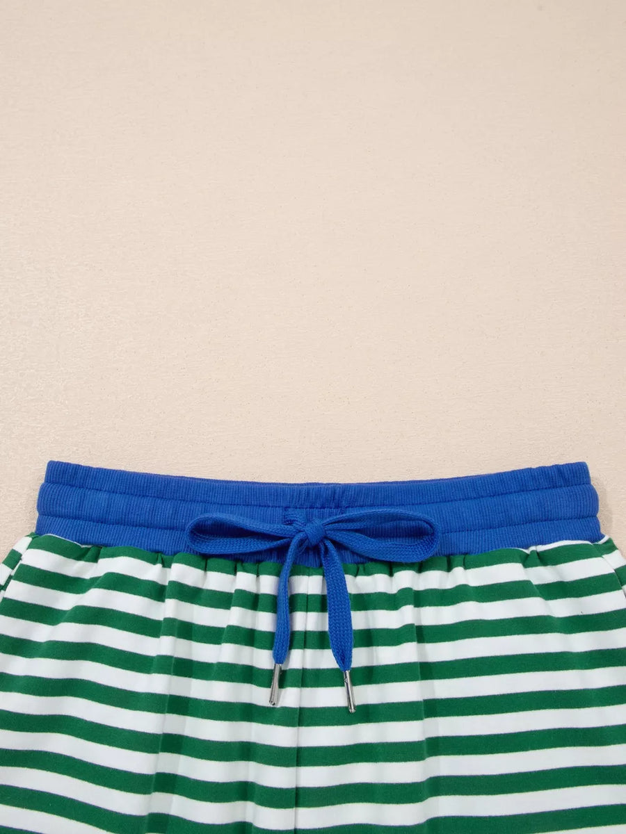 Green and white striped cotton shorts with blue drawstring waist