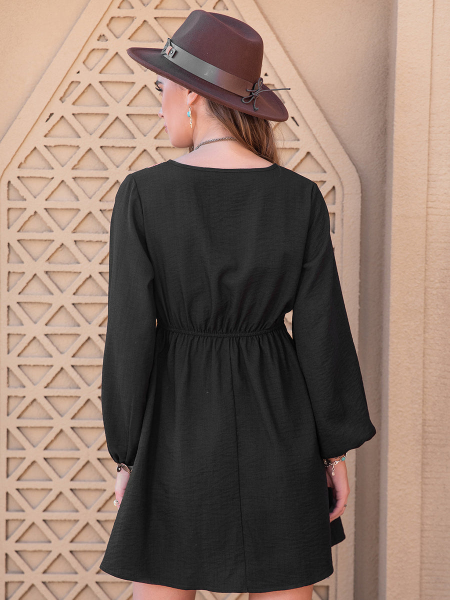 Black embroidered yoke mini dress with long sleeves and elastic waist