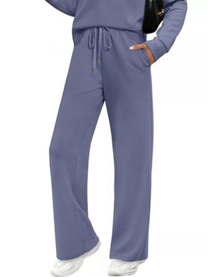 Dusty blue casual long-sleeve top and drawstring pants set with pockets.