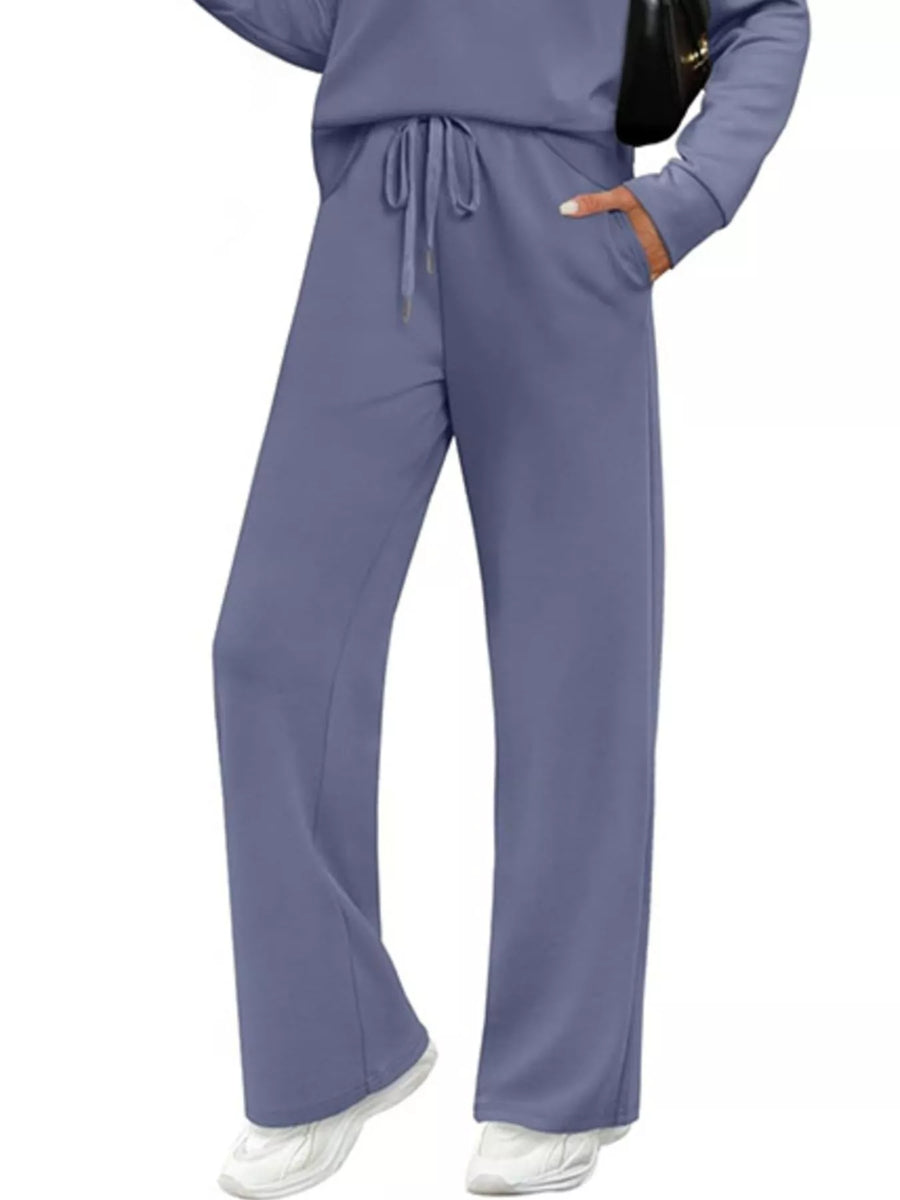 Dusty blue casual long-sleeve top and drawstring pants set with pockets.
