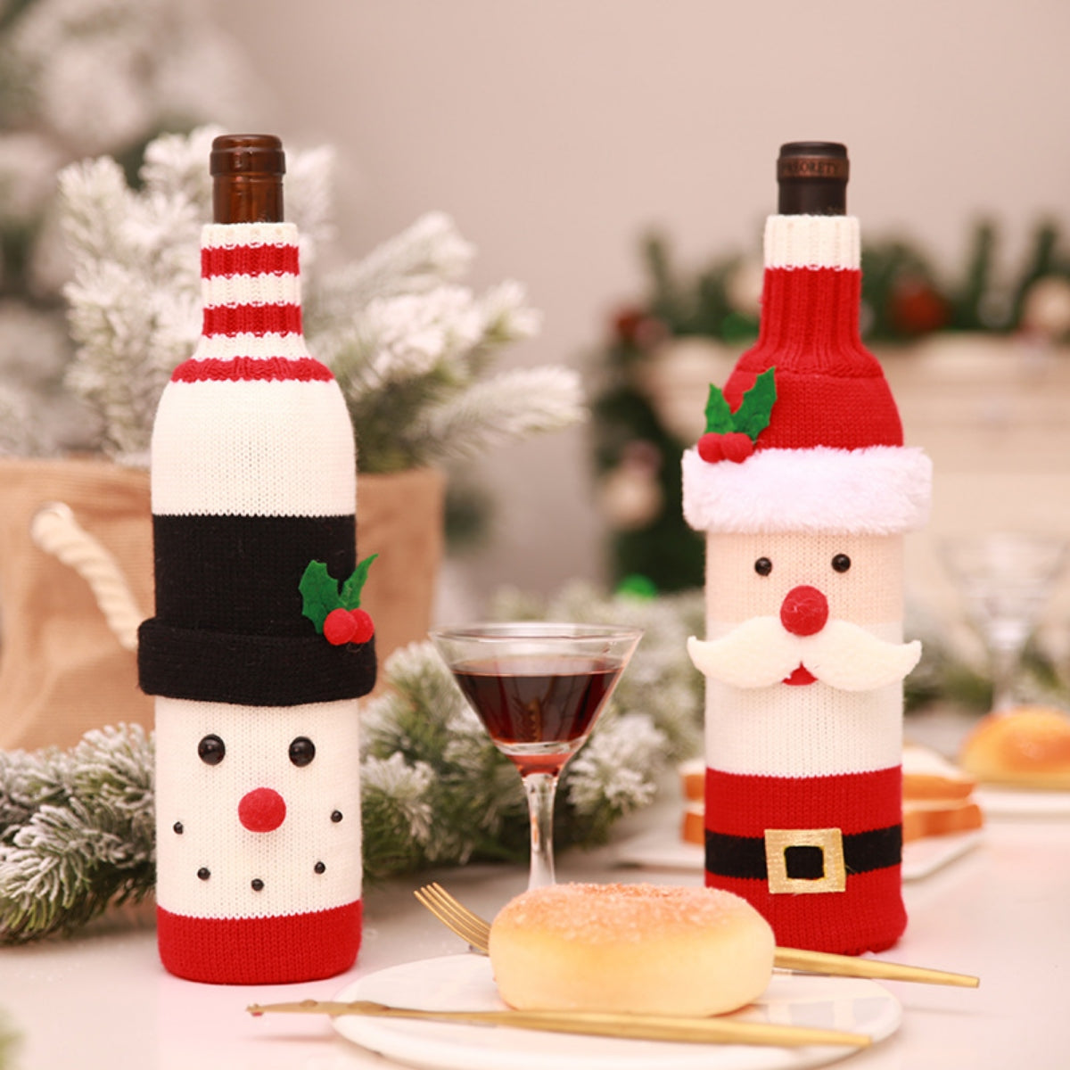Festive knit wine bottle covers in Santa and snowman designs, perfect for Christmas barware.