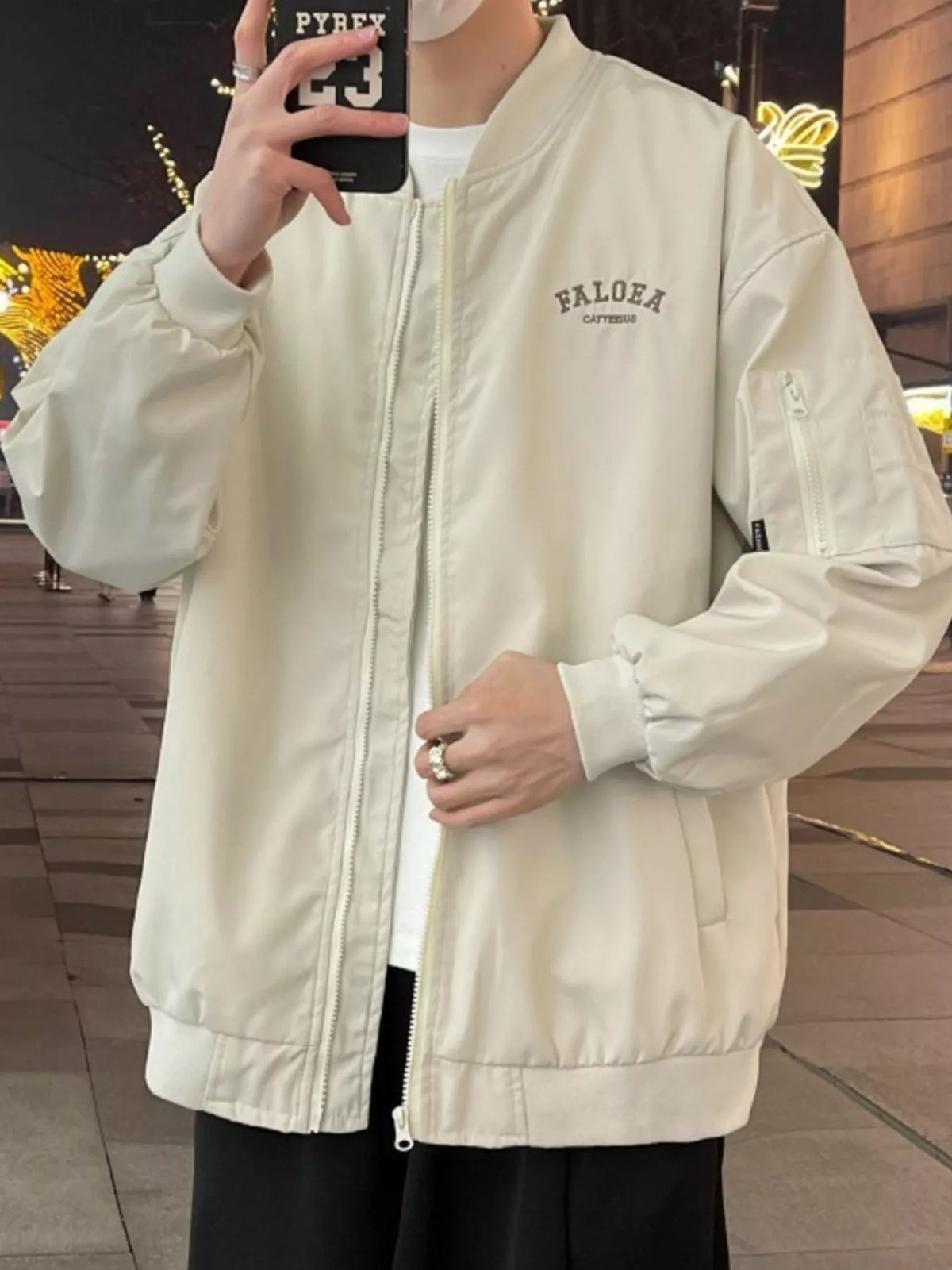 Apricot casual lightweight bomber jacket with zip front and embroidered logo detail.