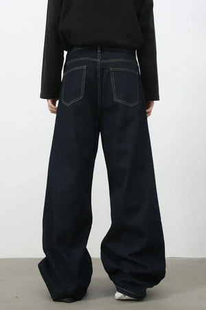 Dark denim exaggerated wide leg jeans with contrast stitching and back pockets.
