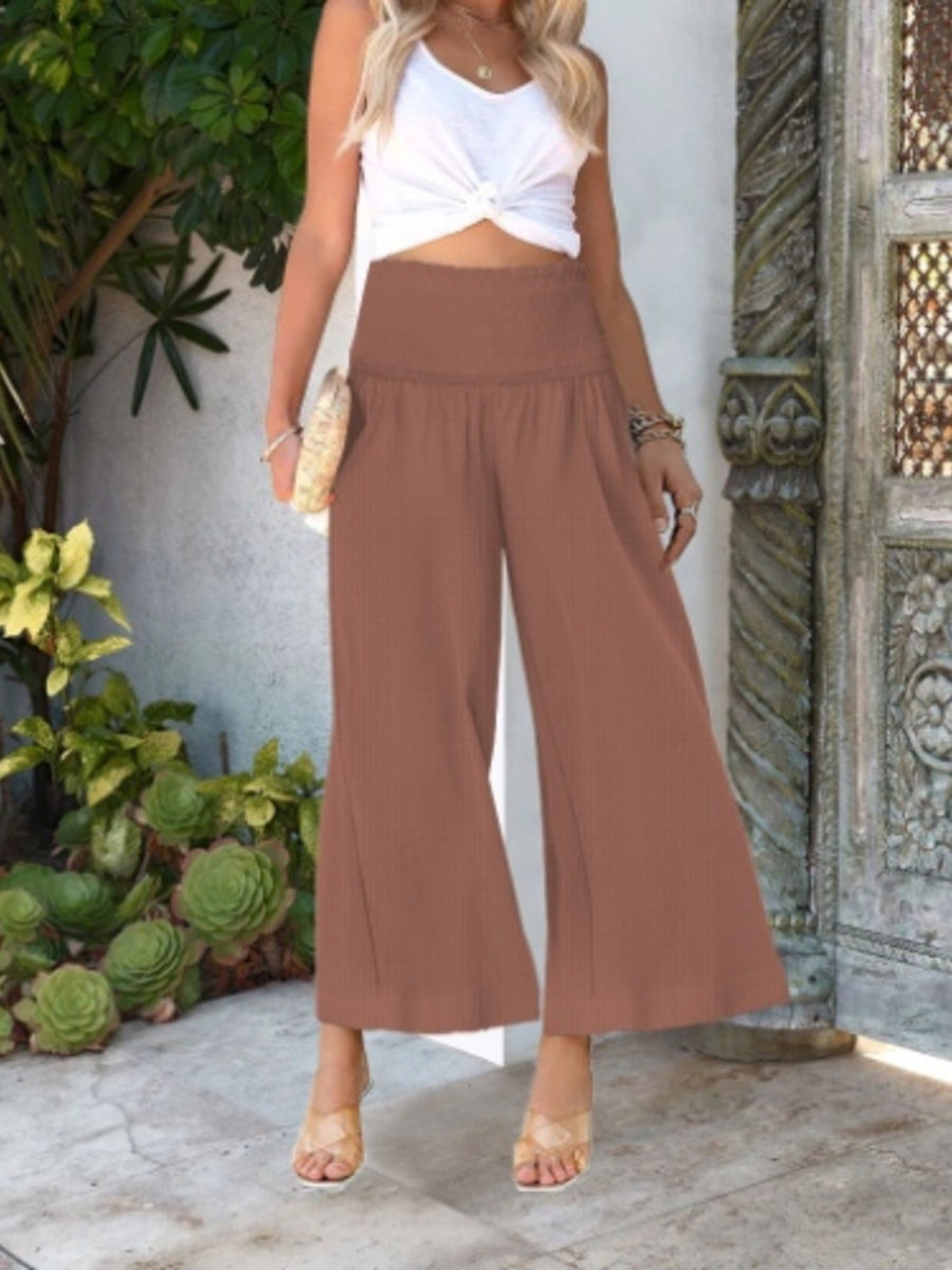 Light Brown smocked waist wide-leg trousers with textured fabric and ankle length.