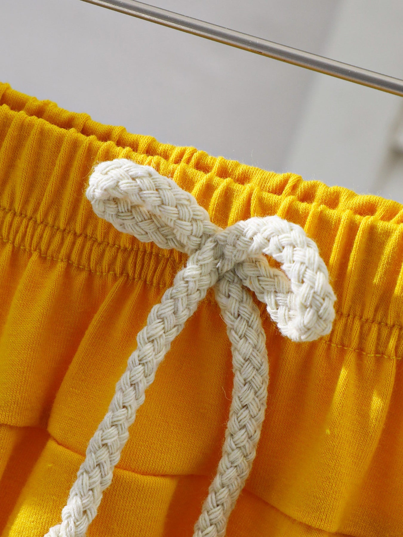 Yellow cotton baby shorts with drawstring detail