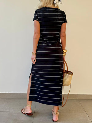 Black and white striped midi t-shirt dress with side slit and short sleeves.
