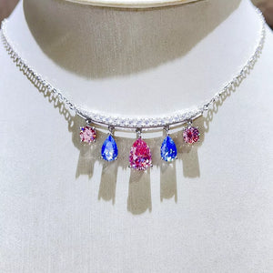 necklace in blue with teardrop moissanite charms and collar