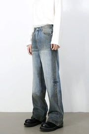 Faded gradient wide-leg jeans in medium wash denim with a relaxed fit.