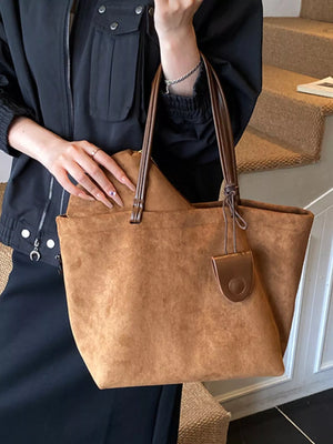 Large caramel brown suede tote bag shopper with leather handles and a small fob detail.