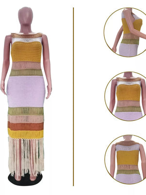 Vibrant knit maxi dress with color block stripes and fringe hem.