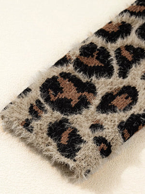 Leopard print fuzzy knit cardigan with a soft texture.