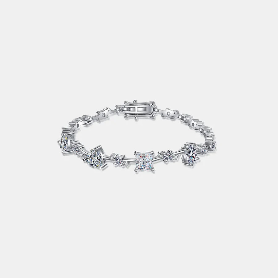 Silver geometric moissanite statement bracelet with assorted diamond cuts and sterling silver chain.