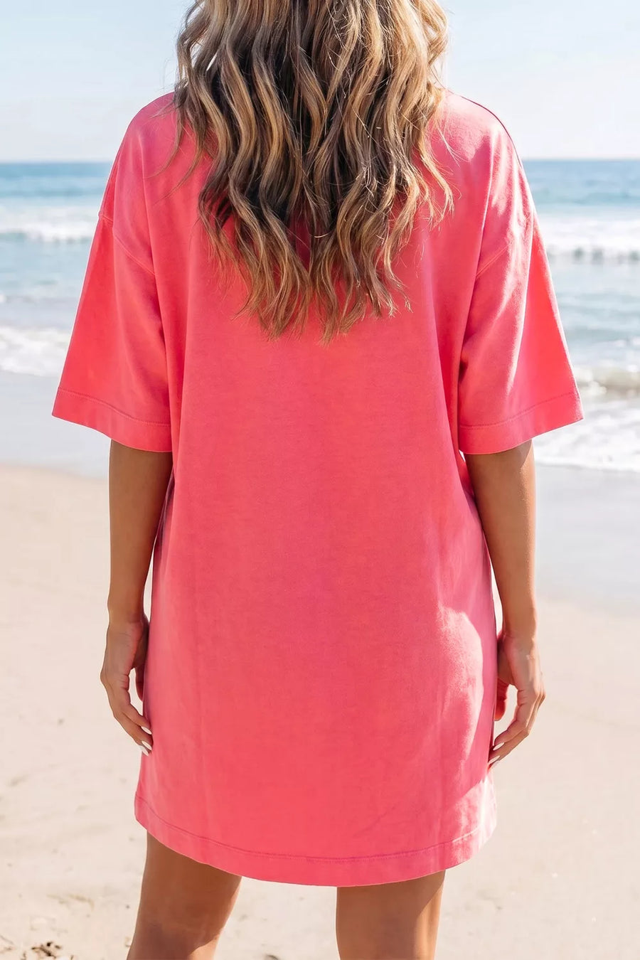 Coral cotton blend t-shirt mini dress with crew neck and drop shoulders.
