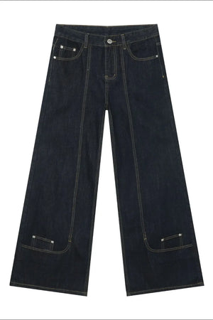 Dark denim trousers with sculptural seam details and wide legs.