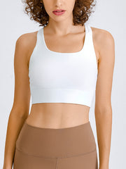 White sculpted racerback crop top with a square neckline and wide band.