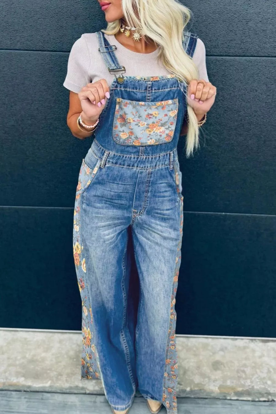 Denim overalls with vintage floral print on pocket and side seams.