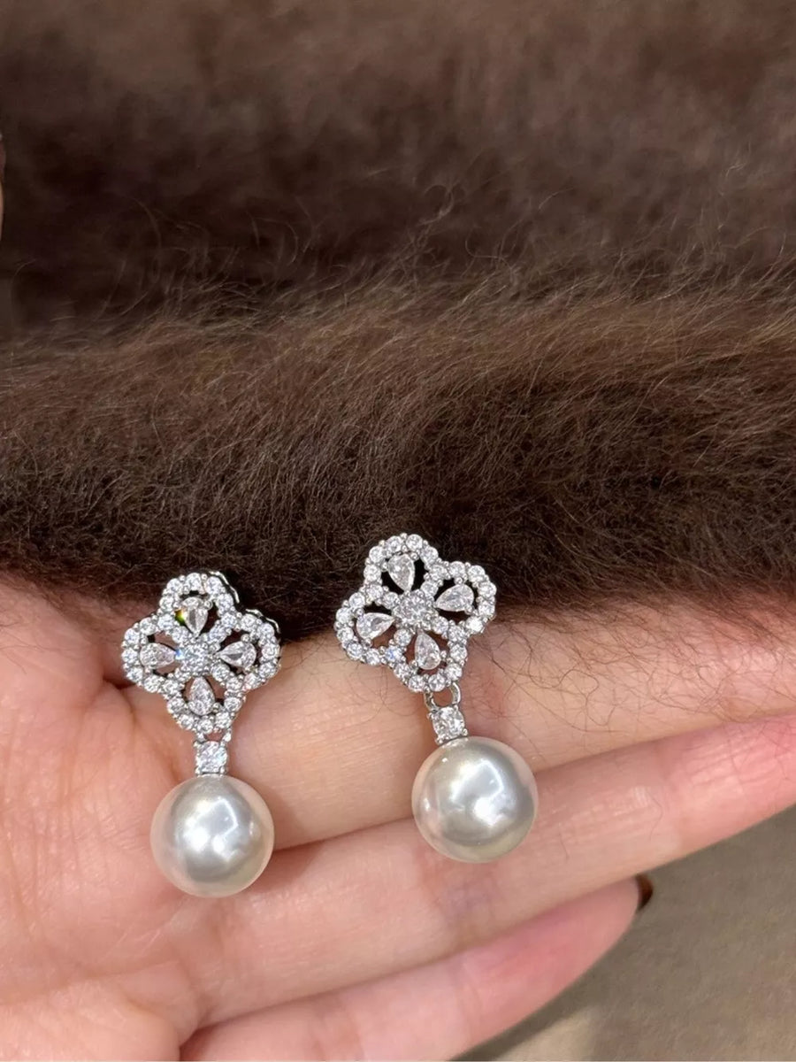 Elegant clover zircon and pearl drop earrings with a beige pearl.