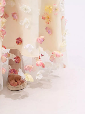 Romantic floral applique tulle maxi dress with pastel flowers and sheer overlay.