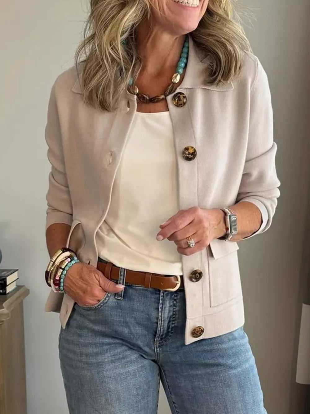 cardigan in light beige featuring buttoned and relaxed fit