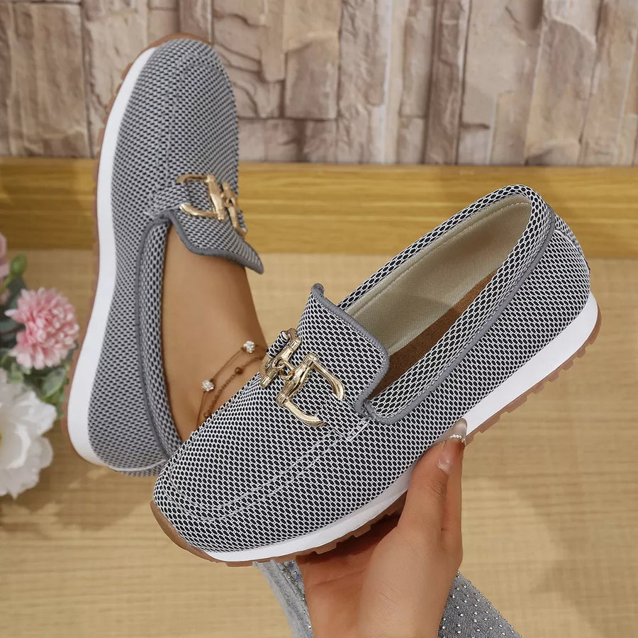 Chic mesh slip-on loafers with gold buckle detail and breathable design.