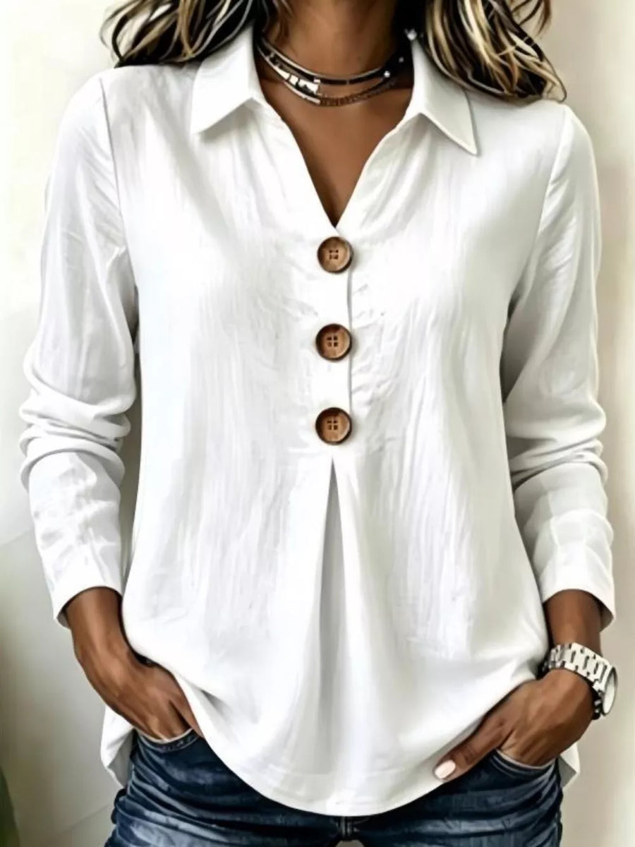 blouse in white featuring buttoned and relaxed fit