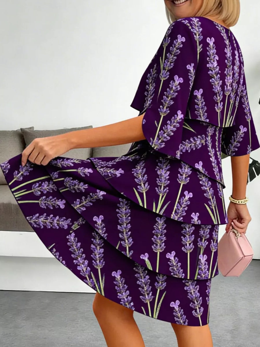 Purple floral tiered ruffle hem dress with flutter sleeves and above-knee length.