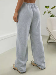 Gray wide-leg maternity joggers with elastic waistband and relaxed fit.