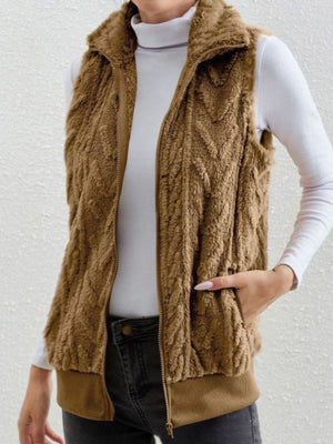 Camel faux fur zip-up vest with chevron texture and ribbed hem.