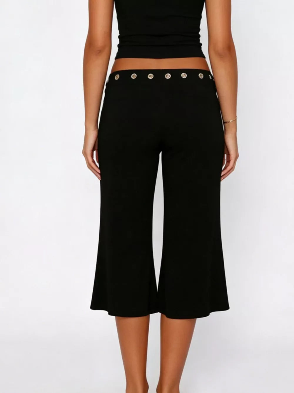 Black flared hem capri pants with button detail at waist
